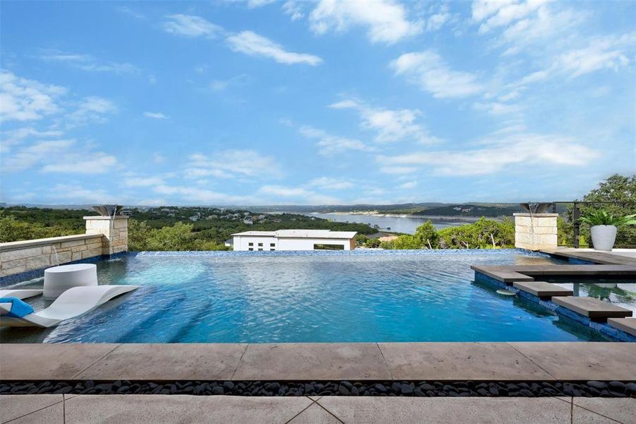 Imagine floating in your own pool with tanning deck, waterfall, fire bowls and magnificent view of Lake Travis.  This part of the lake always has water in it!