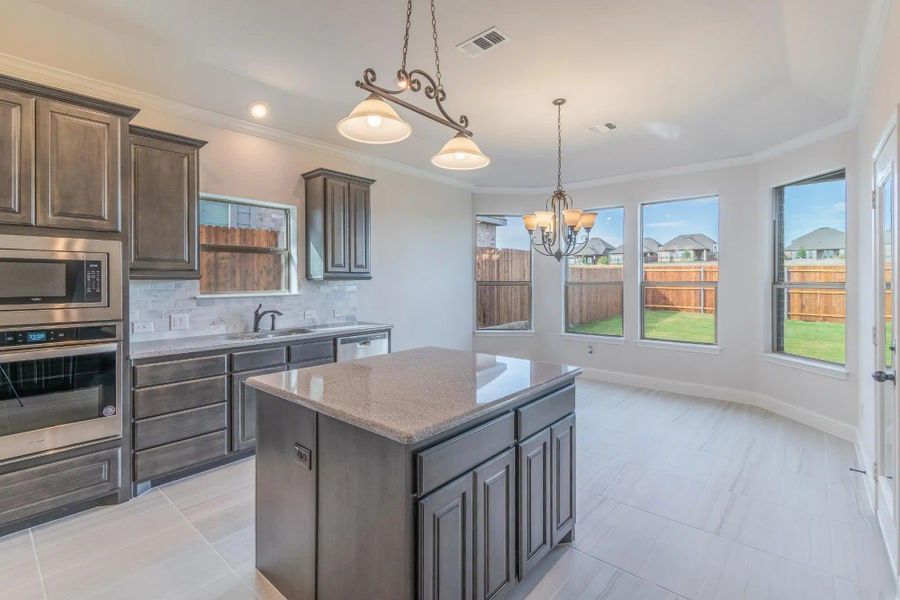 Kitchen | Concept 2027 at Villages of Walnut Grove in Midlothian, TX by Landsea Homes