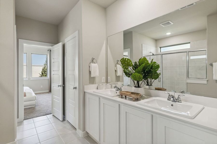 Primary Bathroom in the Oak home plan by Trophy Signature Homes