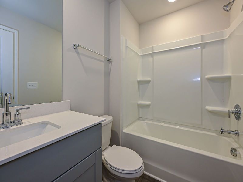 The secondary bathroom makes early mornings a breeze for guests.
