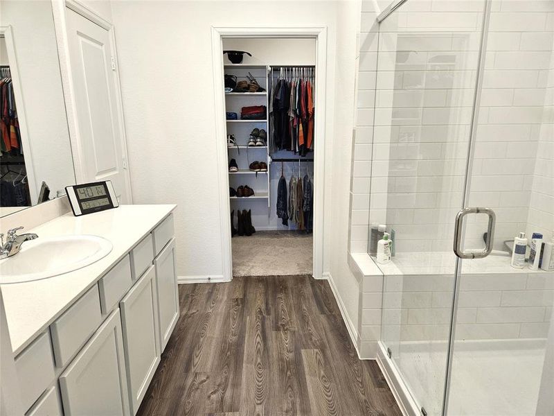 Walk in Shower and large closet that has room to the left and right of the door.