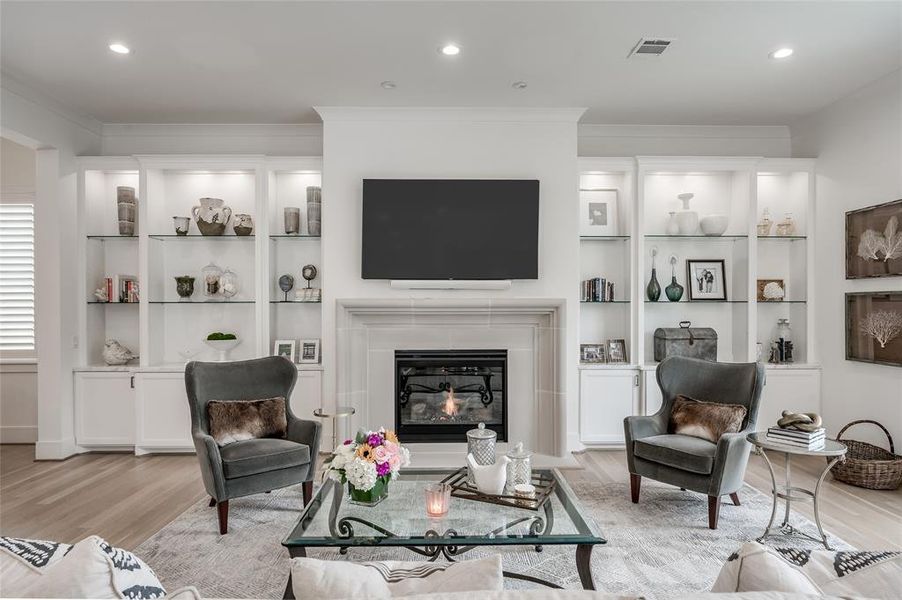 This generously-sized living room/den embraces any decorative trend and is filled with lots of natural light.