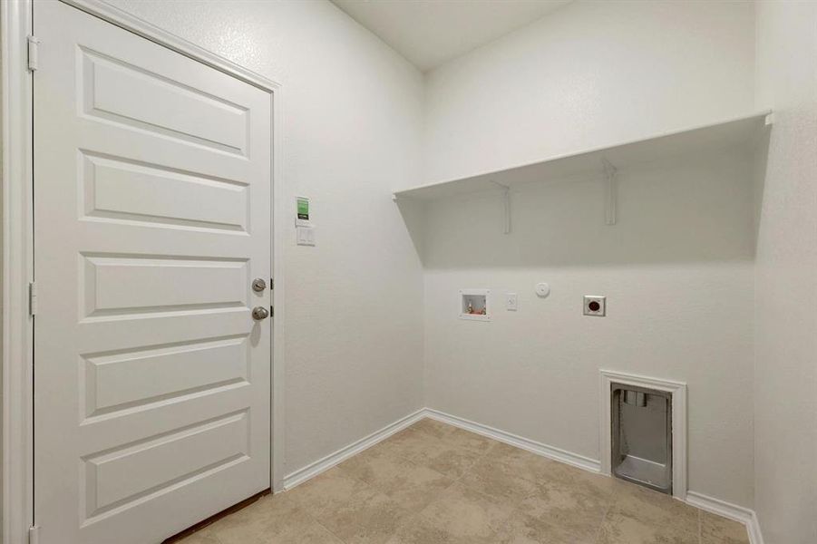 Spacious laundry area, offering ample room for efficient household tasks.