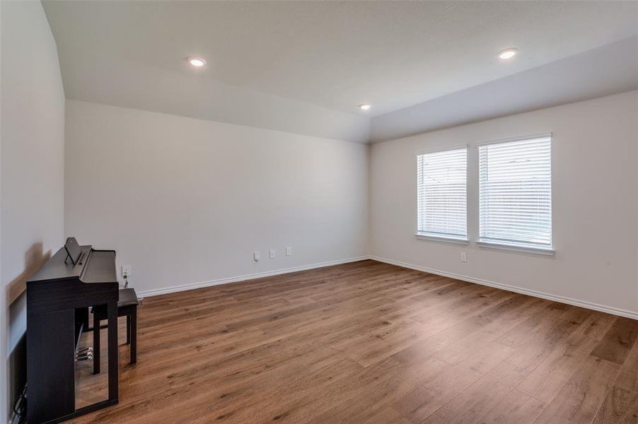 Unfurnished room with hardwood / wood-style floors