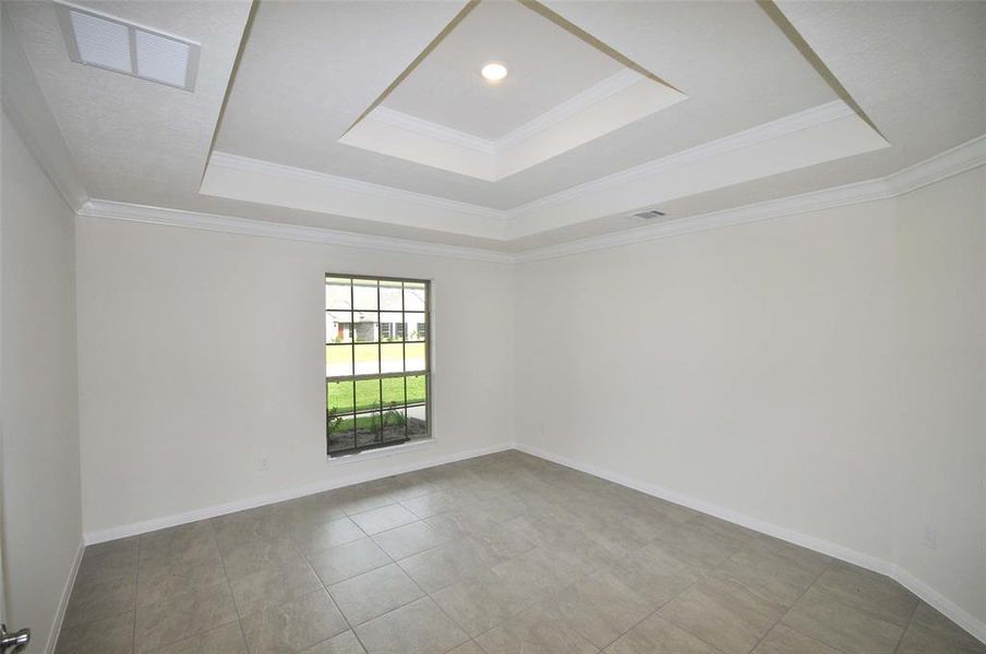 Formal Dining with quality crafted double trey ceiling.