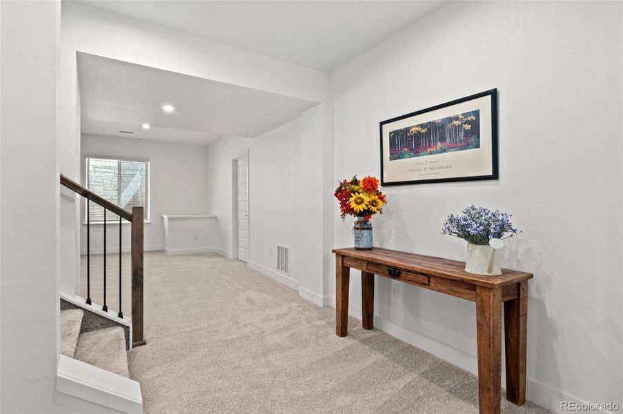 Carpeted basement provides fantastic additional living space and storage