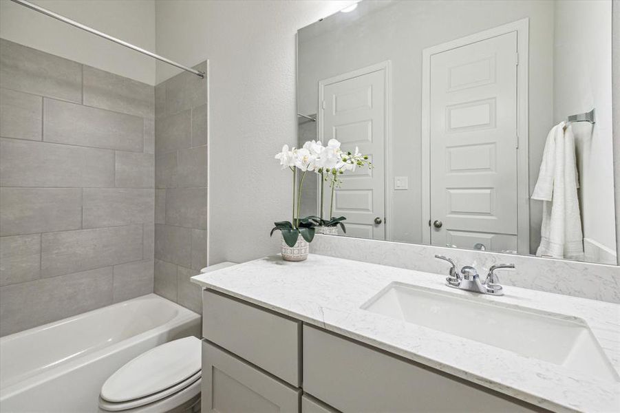 Having a third bathroom conveniently located next to the secondary bedrooms and accessible from the living area is a thoughtful design choice. It provides added convenience for guests and family members staying in those bedrooms, as well as for anyone in the common living spaces.