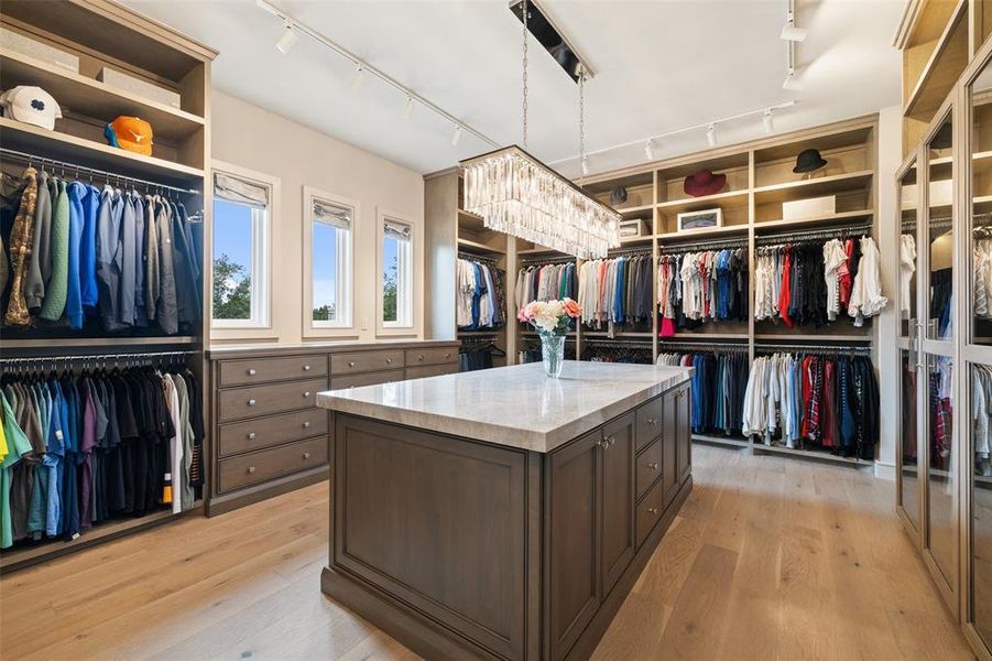 Discover the epitome of organization and luxury in the custom walk-in closet, meticulously designed to showcase your wardrobe with elegance and sophistication.