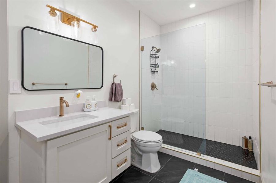 With sleek design elements, the guest bathrooms provide a clean and inviting space for guests to freshen up during their stay.