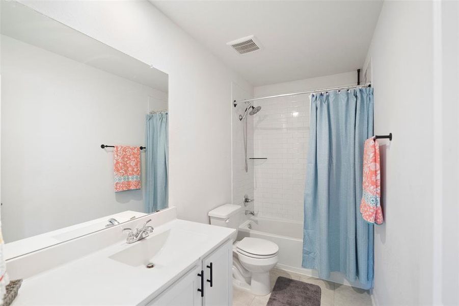 Main bathroom on the second floor.  Lots of vanity space and cabinet space.  Shower/tub combo.