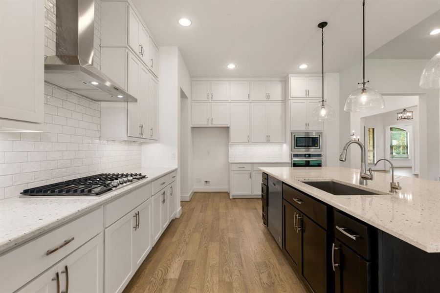 This stunning kitchen is perfect for everyday life as well as entertaining family and friends! Extra large kitchen island is perfect for conversation or that much needed space to lay out your party spread for everyone to enjoy!