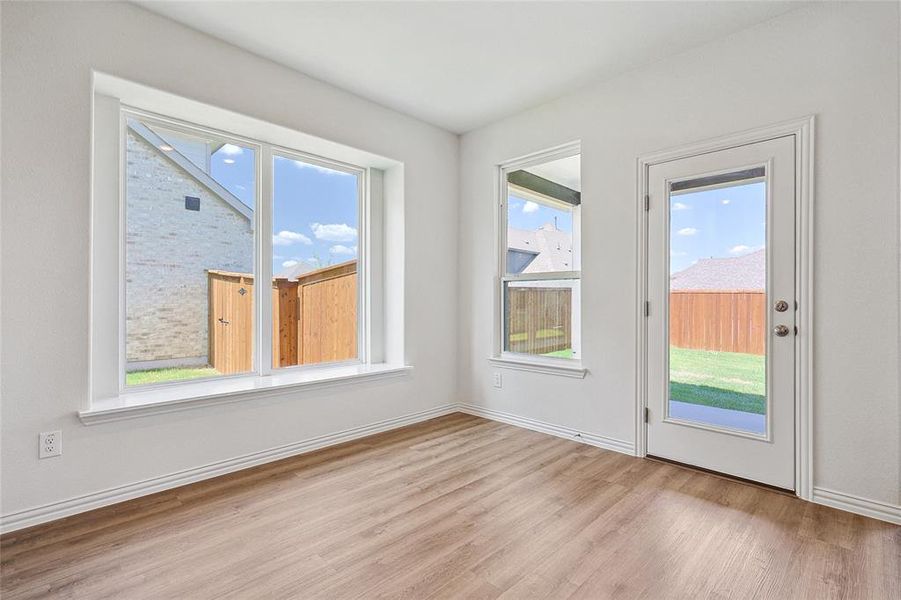 Empty room featuring light hardwood / wood-style flooring