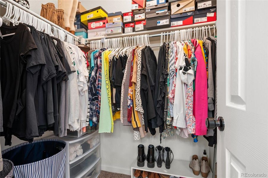 Spacious primary bedroom closet.