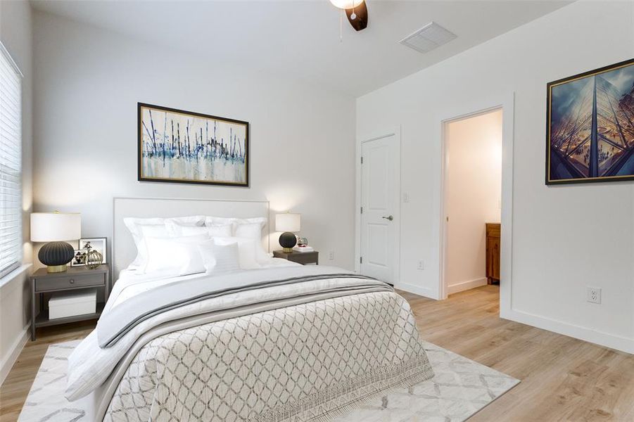 Bedroom featuring light wood-type flooring and ceiling fan