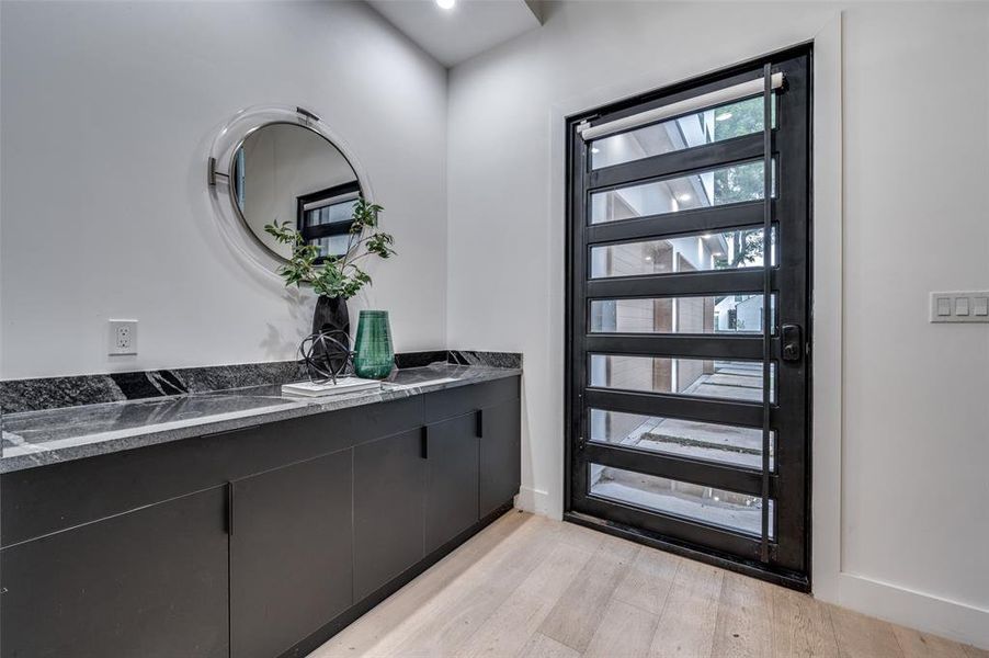 Entrance foyer featuring light hardwood / wood-style floors