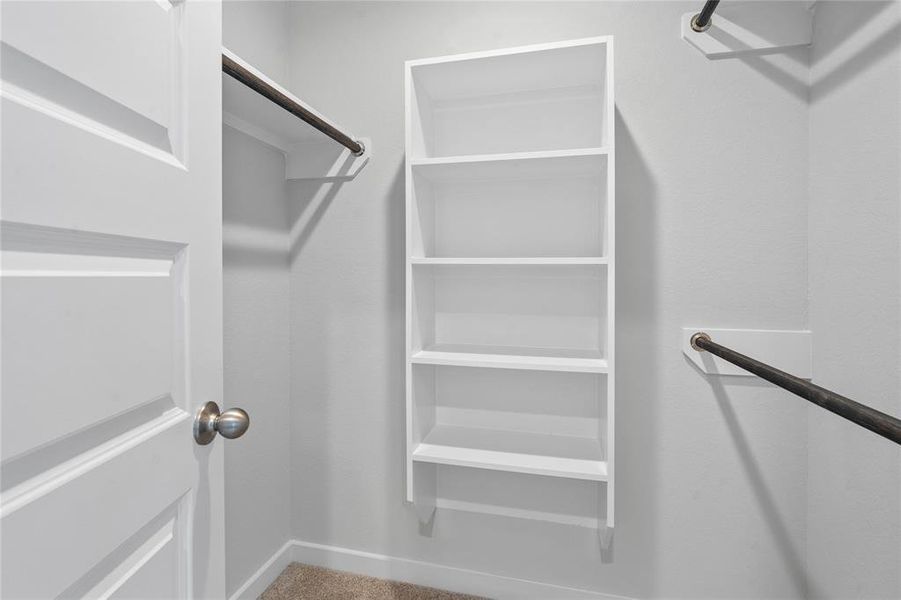 Look at this immaculate closet! With high shelving, multiple rows to hang clothing, you are sure to have enough room for all your belongings!