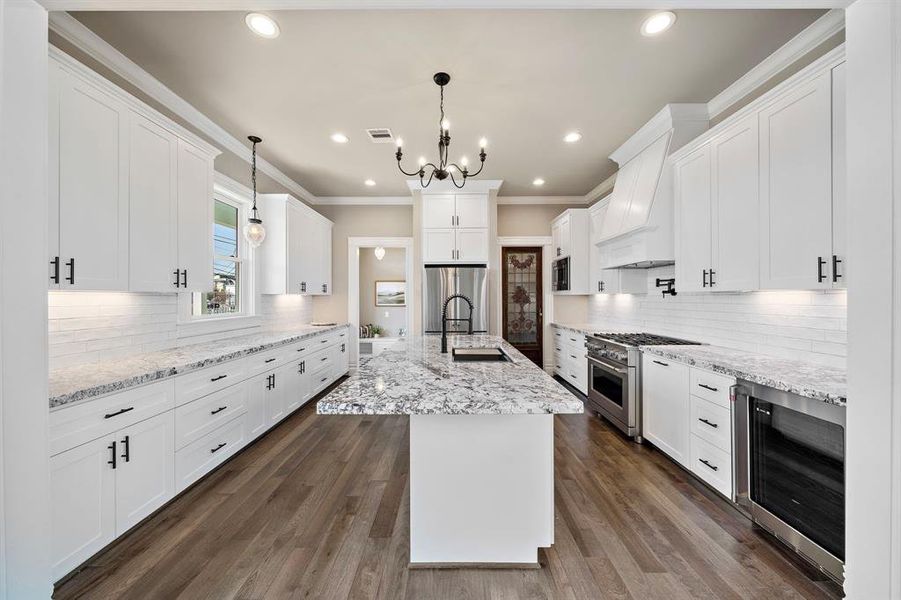 Custom built cabinets. Granite counters. And a fabulous, historic door used as the pantry door (on the right)