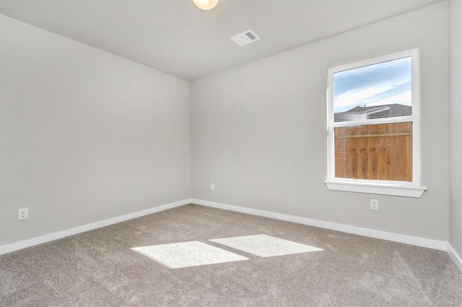 Generously sized secondary bedrooms featuring spacious closets, soft and inviting carpeting underfoot, large windows allowing plenty of natural light, and the added touch of privacy blinds for your personal retreat.  Sample photo of completed plan. As-built color and selections may vary.