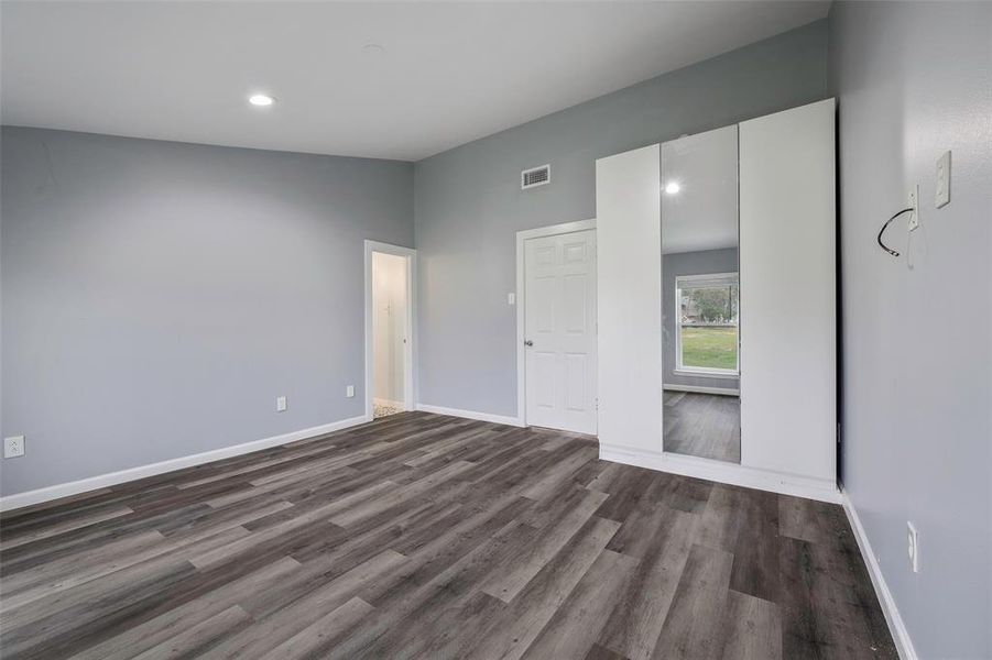 Unfurnished room featuring wood-type flooring