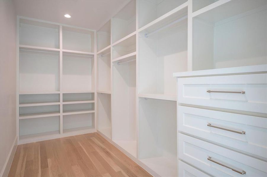 Walk in closet featuring light wood-type flooring