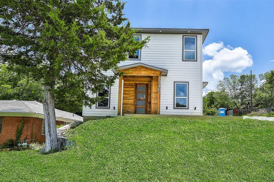 View of front of property with a front yard