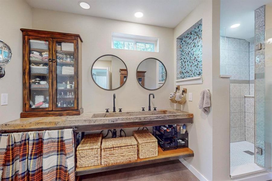 Bathroom featuring vanity and walk in shower