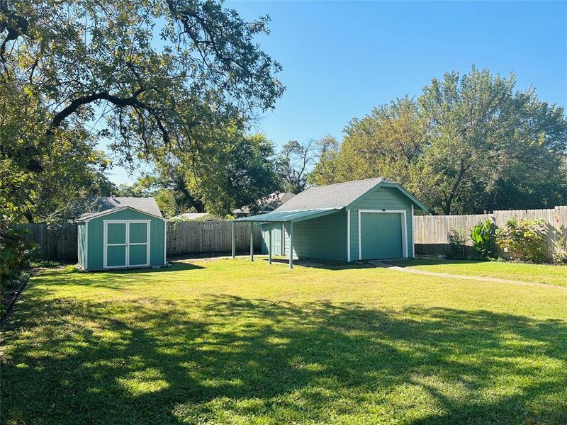 Storage Shed and Garage in back of yard.