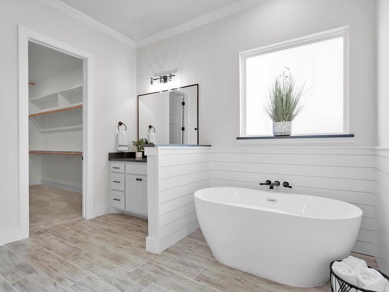 Primary bath with dual vanities, soaking tub, separate shower and ship lap.