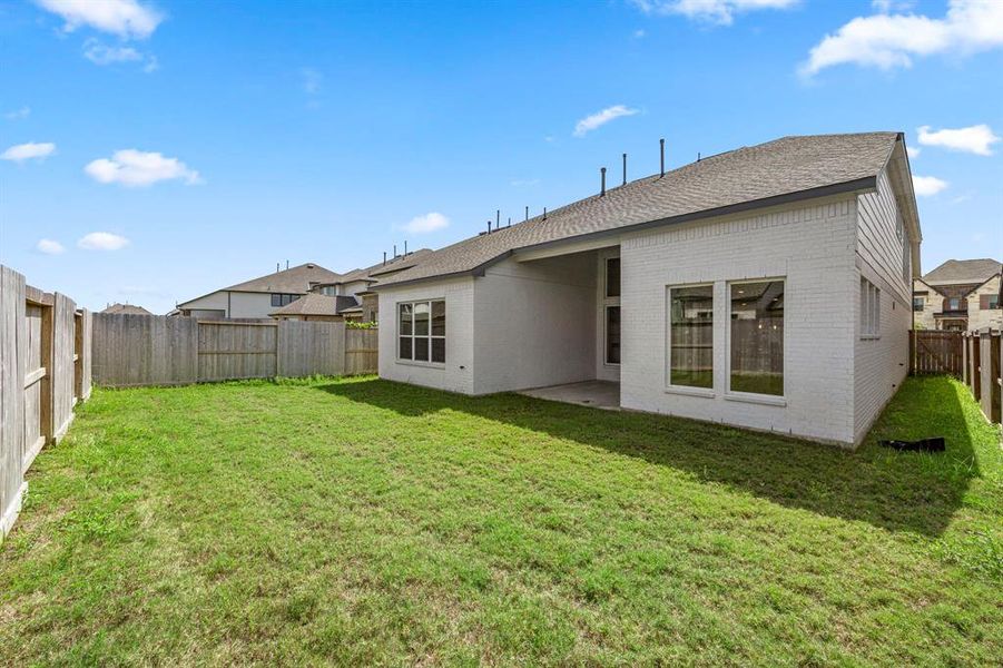 Plenty of room to roam in this backyard.  Expand the patio or add a play space.