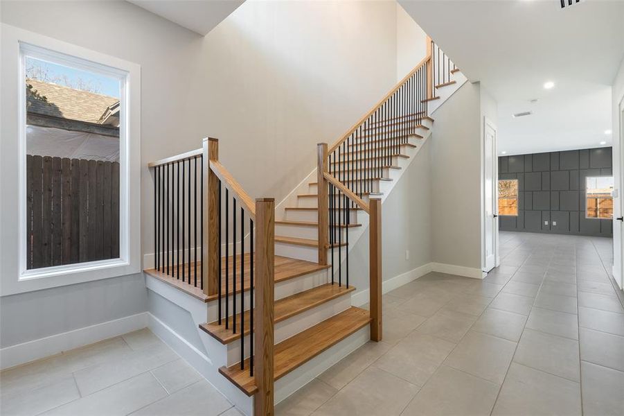 Staircase with tile patterned floors