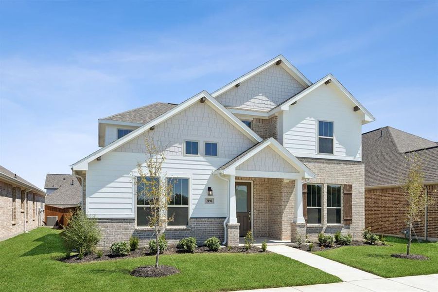 Craftsman-style home with cooling unit and a front lawn