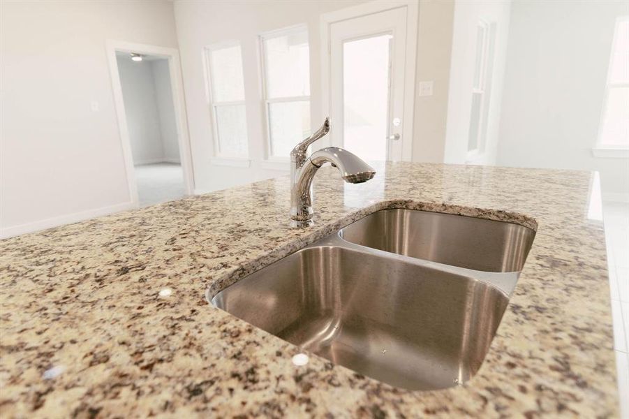 Details with light stone counters and sink