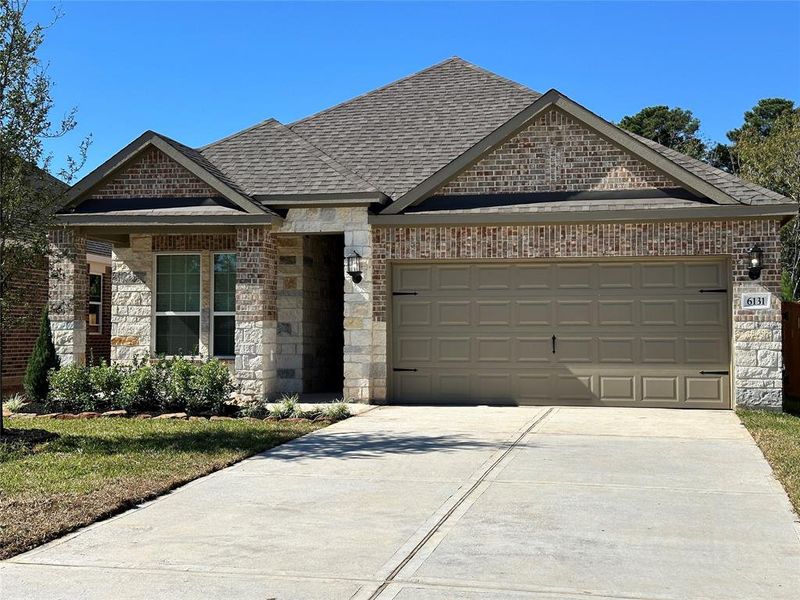 The Alder is a beautiful floorplan with a unique design combination of stone and brick.This beautiful home has water front property.