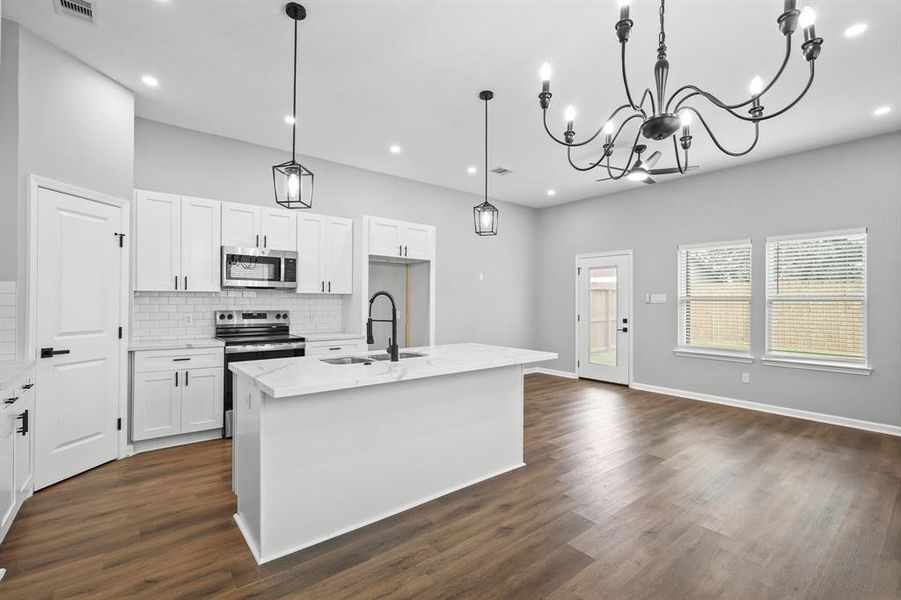 Gorgeous open floor plan! Light and bright kitchen connects with dining space and living room - perfect for entertaining.