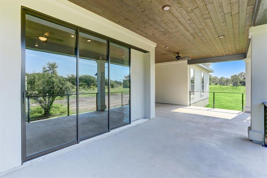 Enjoy the picturesque, Texas Hill Country from the covered patio of this home that comes complete with a built-in outdoor kitchen and ceiling fan.