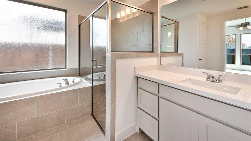 Bathroom with independent shower and bath, vanity, tile patterned flooring, and ceiling fan