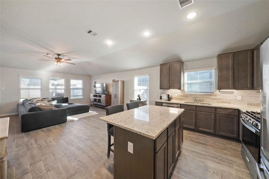 Kitchen opens up to family room.