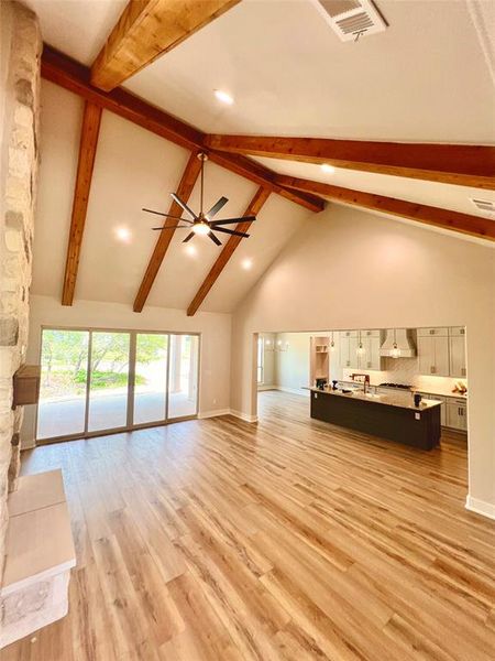 Family room 22x19 with cathedral ceiling and  wood beams