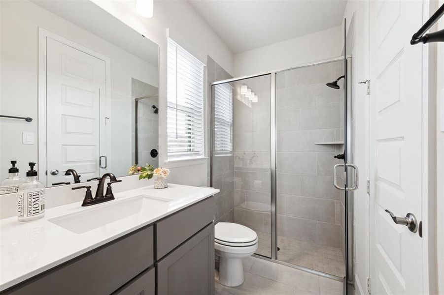 Full bath #2 is an ensuite bath with shower and is accessed directly from lower level bedroom 2.