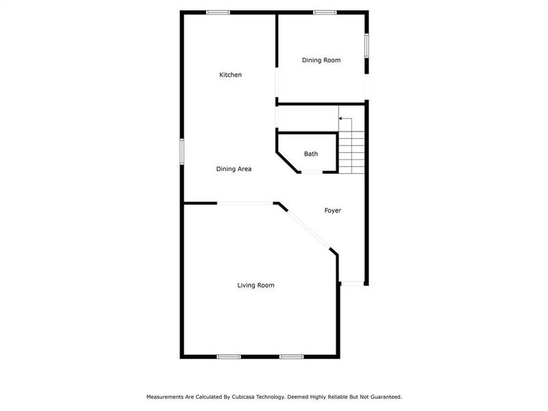 This floor plan features a spacious living room adjacent to a dining area, with a separate kitchen and dining room. There's also a bathroom and a foyer. The layout is practical with distinct spaces for living and dining.