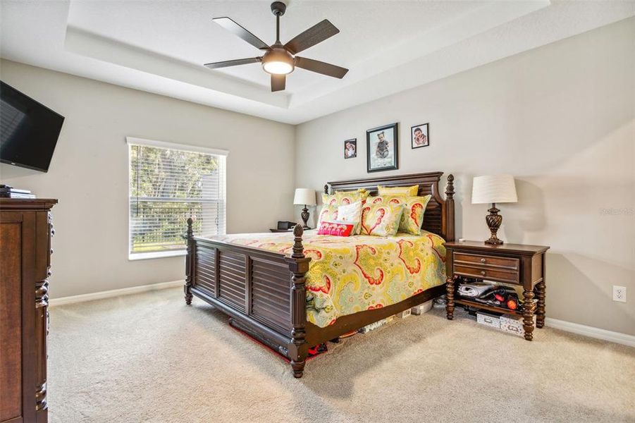 Master bedroom is huge with trey ceiling and ceiling fans.
