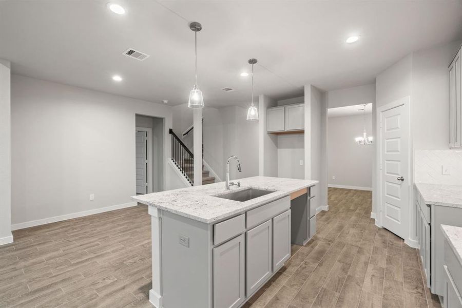Enjoy breakfast with ease in the connected and cozy breakfast area, seamlessly integrated with the kitchen for utmost convenience. Sample photo of completed home with similar floor plan. As-built interior colors and selections may vary.