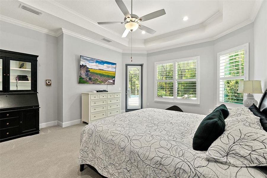 Master Bedroom Suite w/Tray Ceiling, Crown Molding, & Door to Lanai & Pool