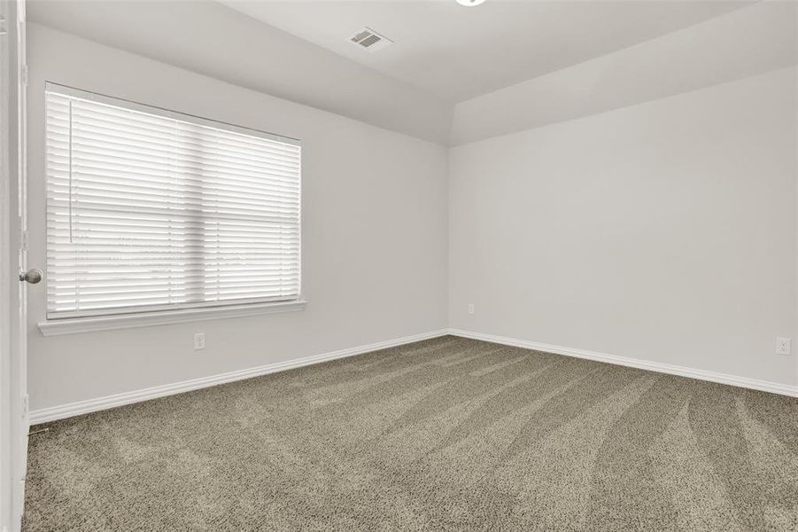 Empty room with carpet flooring