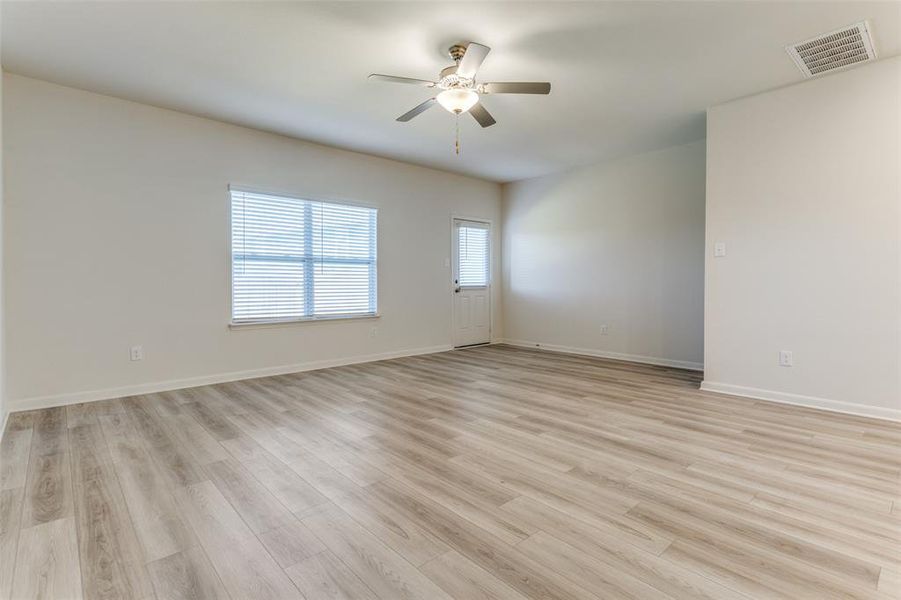 Unfurnished room featuring light hardwood / wood-style floors and ceiling fan