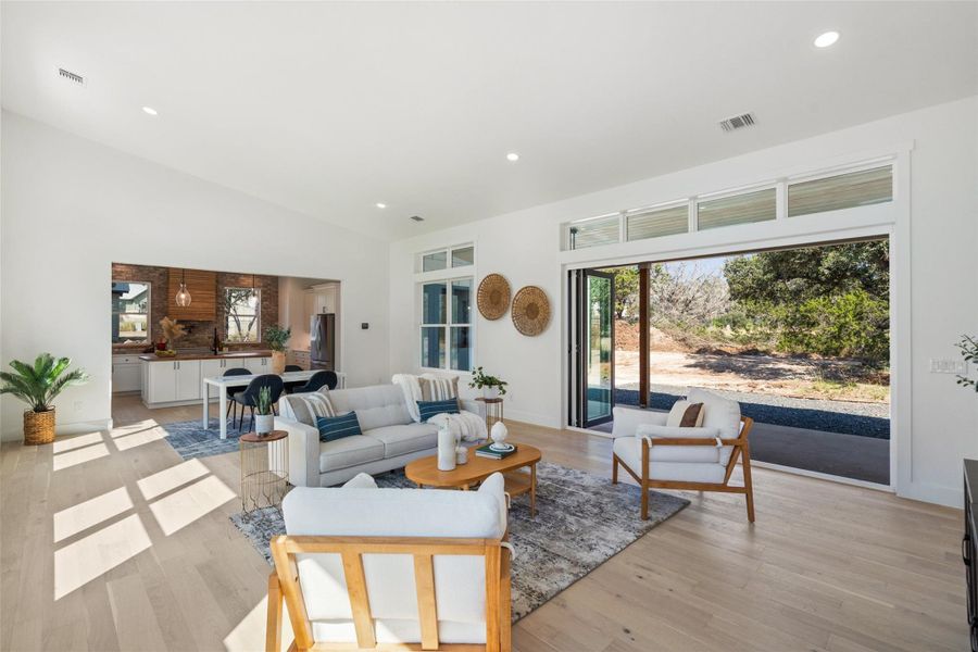 Beautiful white oak flooring throughout, enhancing the modern yet warm farmhouse aesthetic.