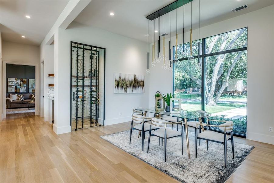 Dining area with light hardwood / wood-style flooring