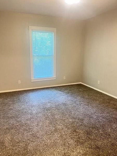 Empty room featuring carpet floors