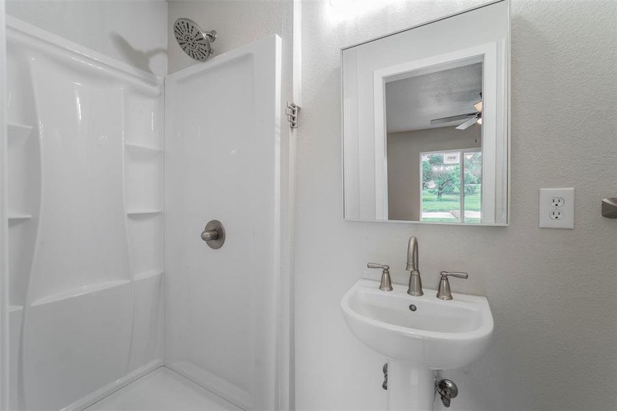 Primary Bathroom with sink and a shower