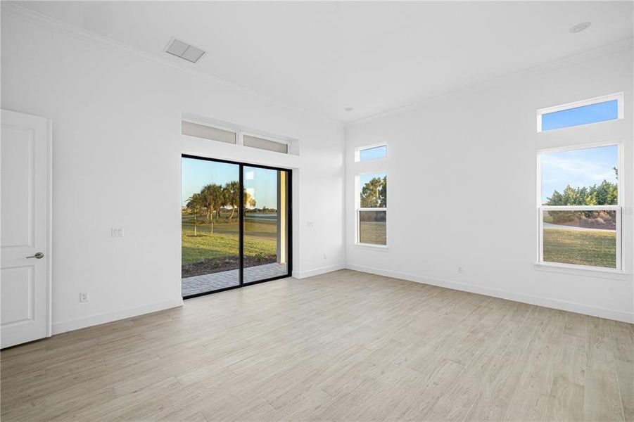 Expansive Club Room with Pocket Sliders overlooking hole number 2 tee box.